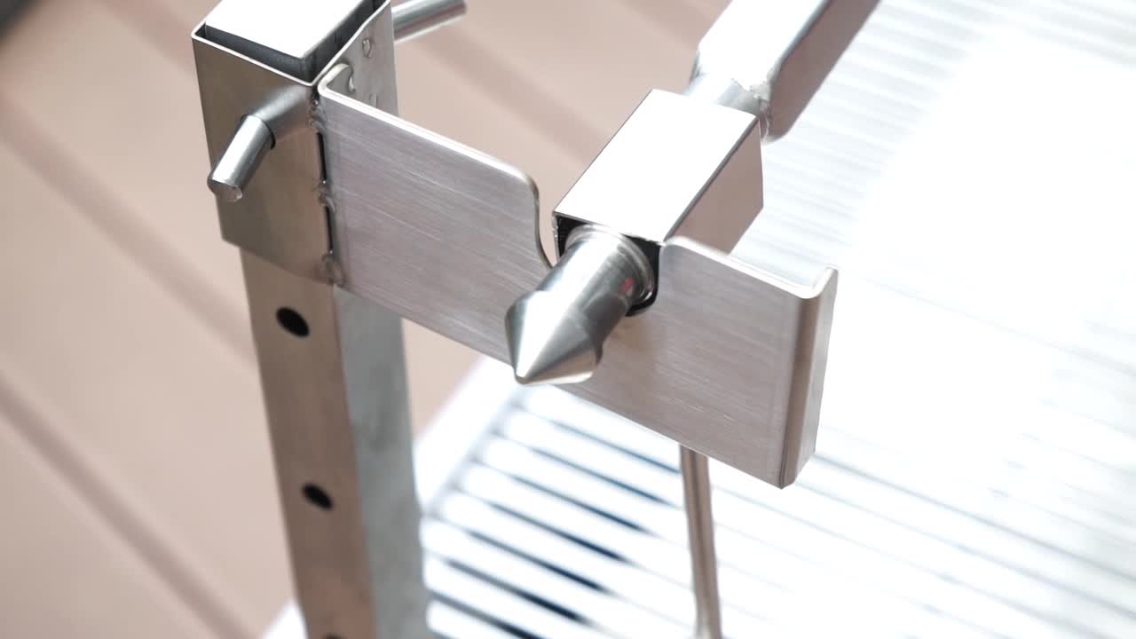 video thumbnail of METRO Professional Holzkohle-/Spanferkelgrill, Edelstahl, 160 x 42 x 95 cm, mit elektrischem Drehspieß, inkl. Grillabdeckung, silber